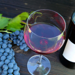 red wine with bottle and grapes